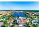 Breathtaking aerial view highlighting the community's resort-style amenities and scenic lakefront setting at 1512 Mumbai Way, Kissimmee, FL 34747