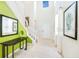 Bright foyer featuring high ceilings, unique decor, neutral walls, and a modern staircase at 1512 Mumbai Way, Kissimmee, FL 34747