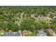 A high angle captures the tree lined street and surrounding neighborhood near this lovely home at 1606 Orangewood Ave, Orlando, FL 32806