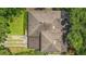 This aerial view showcases a roof, driveway, and landscaping of a well-maintained home at 1606 Orangewood Ave, Orlando, FL 32806