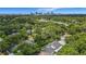 Aerial view of property showcasing landscaping, lake, and downtown skyline at 1606 Orangewood Ave, Orlando, FL 32806