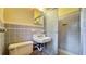 Bathroom featuring tiled walls and a shower at 1606 Orangewood Ave, Orlando, FL 32806