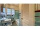 Retro bathroom with colorful tiles, vintage fixtures, and a window at 1606 Orangewood Ave, Orlando, FL 32806