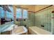 Classic bathroom featuring vintage fixtures, colorful tiles, and natural light at 1606 Orangewood Ave, Orlando, FL 32806