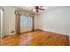 Bright bedroom featuring hardwood floors, a window, and neutral walls at 1606 Orangewood Ave, Orlando, FL 32806