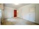Bedroom featuring carpet flooring and two closets at 1606 Orangewood Ave, Orlando, FL 32806