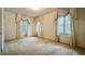 Spacious bedroom featuring carpet flooring, neutral walls, and large windows at 1606 Orangewood Ave, Orlando, FL 32806