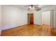 Bedroom with hardwood floors, closet, and doorway to another room at 1606 Orangewood Ave, Orlando, FL 32806