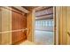 Walk-in closet leading into a sunroom with bright light from surrounding windows at 1606 Orangewood Ave, Orlando, FL 32806