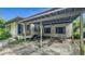 Charming home featuring a covered carport, black door, porch, and an inviting exterior at 1606 Orangewood Ave, Orlando, FL 32806