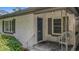 Home exterior showcasing front porch, dark door and textured stucco at 1606 Orangewood Ave, Orlando, FL 32806