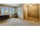 Cozy room with wall paper, carpet, and large windows to let in natural light at 1606 Orangewood Ave, Orlando, FL 32806