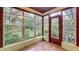 Bright sunroom offering lush backyard views at 1606 Orangewood Ave, Orlando, FL 32806