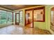 Bright sunroom offering abundant natural light and tile flooring overlooking the kitchen at 1606 Orangewood Ave, Orlando, FL 32806