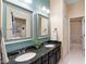 Bathroom boasts granite countertops and dual sinks with a view of the outside at 1689 Wingspan Way, Winter Springs, FL 32708