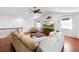 Upstairs bonus room with hardwood floors, comfortable seating, and bright windows at 1689 Wingspan Way, Winter Springs, FL 32708
