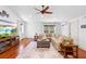 Spacious bonus room with hardwood floors, ample seating, and natural light at 1689 Wingspan Way, Winter Springs, FL 32708