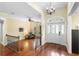Bright foyer featuring hardwood floors, and a view of the living area at 1689 Wingspan Way, Winter Springs, FL 32708