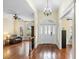 Elegant foyer featuring hardwood floors, a chandelier, and a grand entrance at 1689 Wingspan Way, Winter Springs, FL 32708