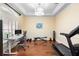 Bright home gym featuring a treadmill, weights, and a modern desk setup at 1689 Wingspan Way, Winter Springs, FL 32708