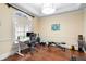Bright home gym featuring exercise equipment and a functional desk area at 1689 Wingspan Way, Winter Springs, FL 32708