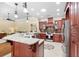 Spacious kitchen with island, custom cabinets, and stainless steel appliances; open to the living area at 1689 Wingspan Way, Winter Springs, FL 32708