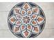 Close up of kitchen floor featuring mosaic design with flower-like pattern in orange and brown at 1689 Wingspan Way, Winter Springs, FL 32708