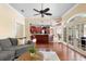 Open floor plan with living room, kitchen, and dining area at 1689 Wingspan Way, Winter Springs, FL 32708