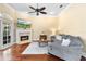 Comfortable living room with fireplace and neutral decor at 1689 Wingspan Way, Winter Springs, FL 32708