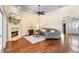 Bright living room features hardwood floors and a fireplace at 1689 Wingspan Way, Winter Springs, FL 32708