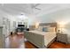 Serene main bedroom with hardwood floors, tray ceiling, and ample natural light at 1689 Wingspan Way, Winter Springs, FL 32708