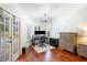 Well-lit home office with french doors to the pool, hard wood floors and wainscotting at 1689 Wingspan Way, Winter Springs, FL 32708