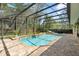 Private pool with an expansive screened enclosure and patio area at 1689 Wingspan Way, Winter Springs, FL 32708