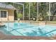 A refreshing screened pool surrounded by brick pavers, offering a serene backyard oasis at 1689 Wingspan Way, Winter Springs, FL 32708