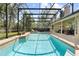 Inviting in-ground pool and screened enclosure provides the perfect space for outdoor relaxation and entertainment at 1689 Wingspan Way, Winter Springs, FL 32708