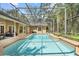 Screened-in pool with an attached seating area at 1689 Wingspan Way, Winter Springs, FL 32708