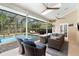 Inviting screened-in lanai boasts a private pool and comfortable seating area at 1689 Wingspan Way, Winter Springs, FL 32708