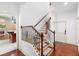 Beautiful staircase with decorative wrought iron and wood railing at 1689 Wingspan Way, Winter Springs, FL 32708