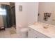 Bright bathroom with a shower, neutral wall color, and a white sink vanity with storage at 1764 Carillon Park Dr, Oviedo, FL 32765