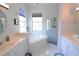 Bathroom with soaking tub, glass-enclosed shower, and double sink vanity at 1764 Carillon Park Dr, Oviedo, FL 32765