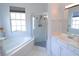 Bathroom featuring soaking tub, separate shower and vanity with mirror at 1764 Carillon Park Dr, Oviedo, FL 32765