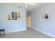 Bedroom with blue walls and light wood floors. The walls have modern art at 1764 Carillon Park Dr, Oviedo, FL 32765