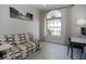 Cozy bedroom featuring a window seat, futon, desk, and neutral decor at 1764 Carillon Park Dr, Oviedo, FL 32765