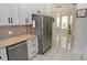 Bright kitchen with stainless steel appliances, granite counters, and breakfast bar with open floor plan at 1764 Carillon Park Dr, Oviedo, FL 32765