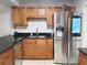 Kitchen features stainless steel appliances, granite counters, and ample cabinet space at 1902 Sarazen Dr, Orlando, FL 32808