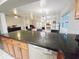 Kitchen with granite countertops, stainless steel appliances, and open view to living space at 1902 Sarazen Dr, Orlando, FL 32808