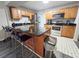 Kitchen featuring granite counters, stainless steel appliances, and a convenient island with bar stool seating at 1902 Sarazen Dr, Orlando, FL 32808