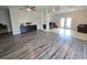 Living room with hardwood floors, unique wall decor, and access to a back patio at 1902 Sarazen Dr, Orlando, FL 32808