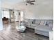 Cozy living room with a plush gray sectional sofa and stylish decor, offering a welcoming space at 1902 Sarazen Dr, Orlando, FL 32808