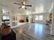 Open floor plan living room with hardwood floors and unique wall mirrors at 1902 Sarazen Dr, Orlando, FL 32808